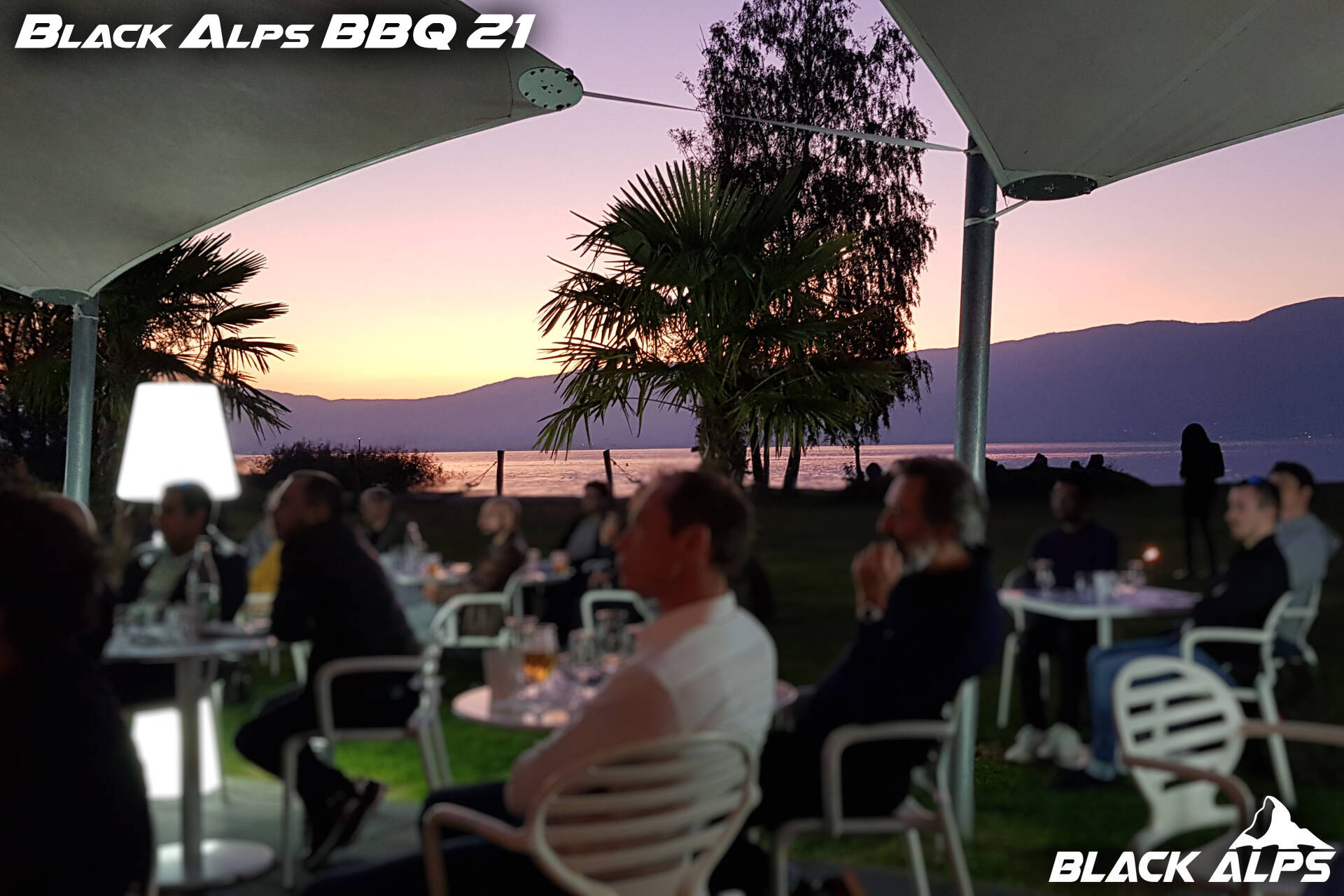 Participants interacting at the Black Alps BBQ event